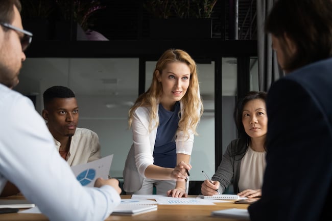 woman leading team meeting woman leading team meeting
